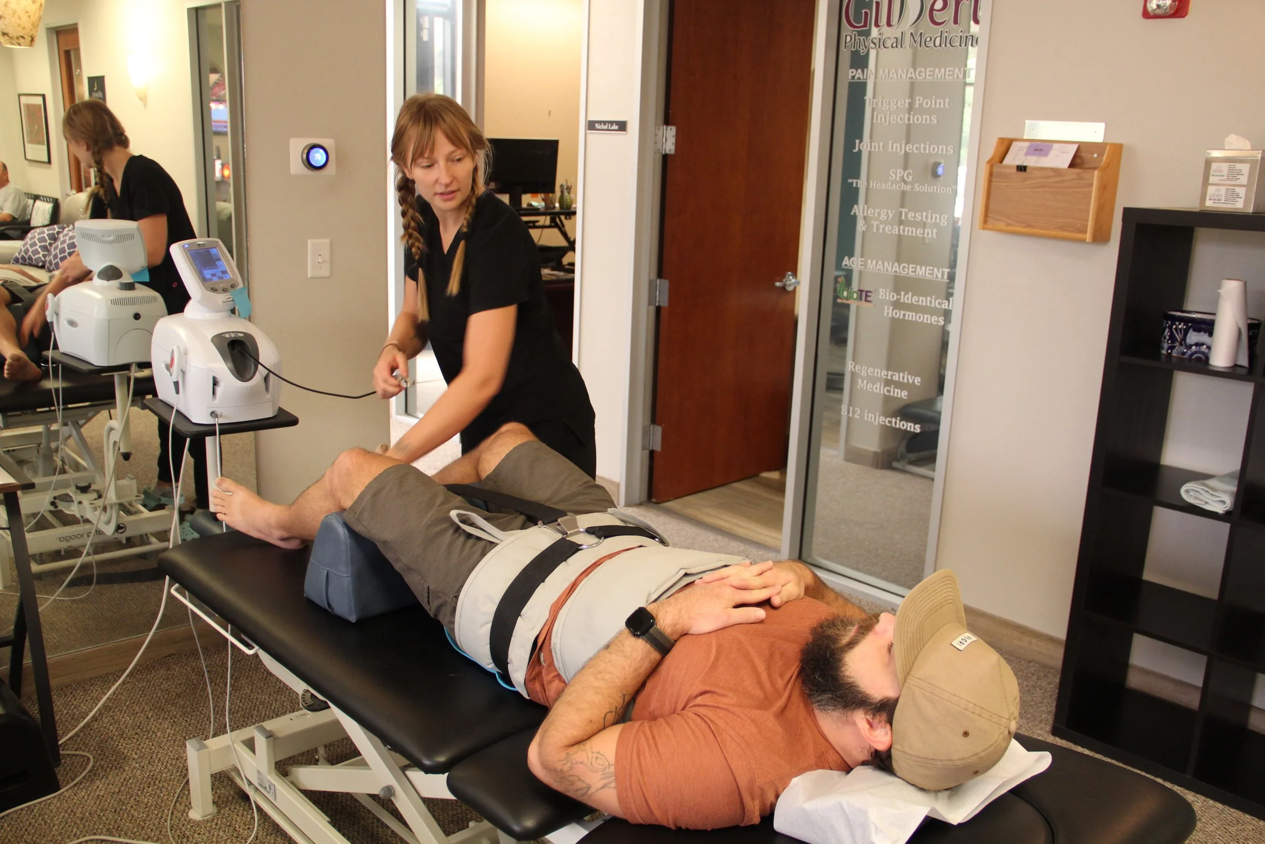 Spinal decompression equipment in use at Gilbert Physical Medicine.